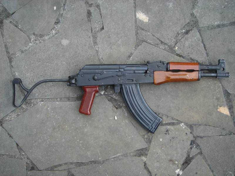 90 carbine with its short barrel and front sight integrated with gas block....